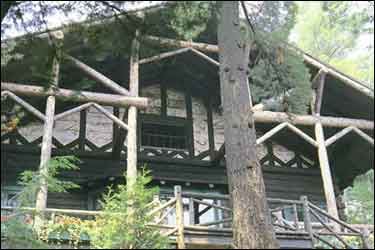 Adirondack Luxury Lodge Rental Adirondack Lodging located on a private island on Upper Saranac Lake near Lake Placid, NY and Saranac Lake, New York with fireplaces, watercraft, spa and featherbeds.